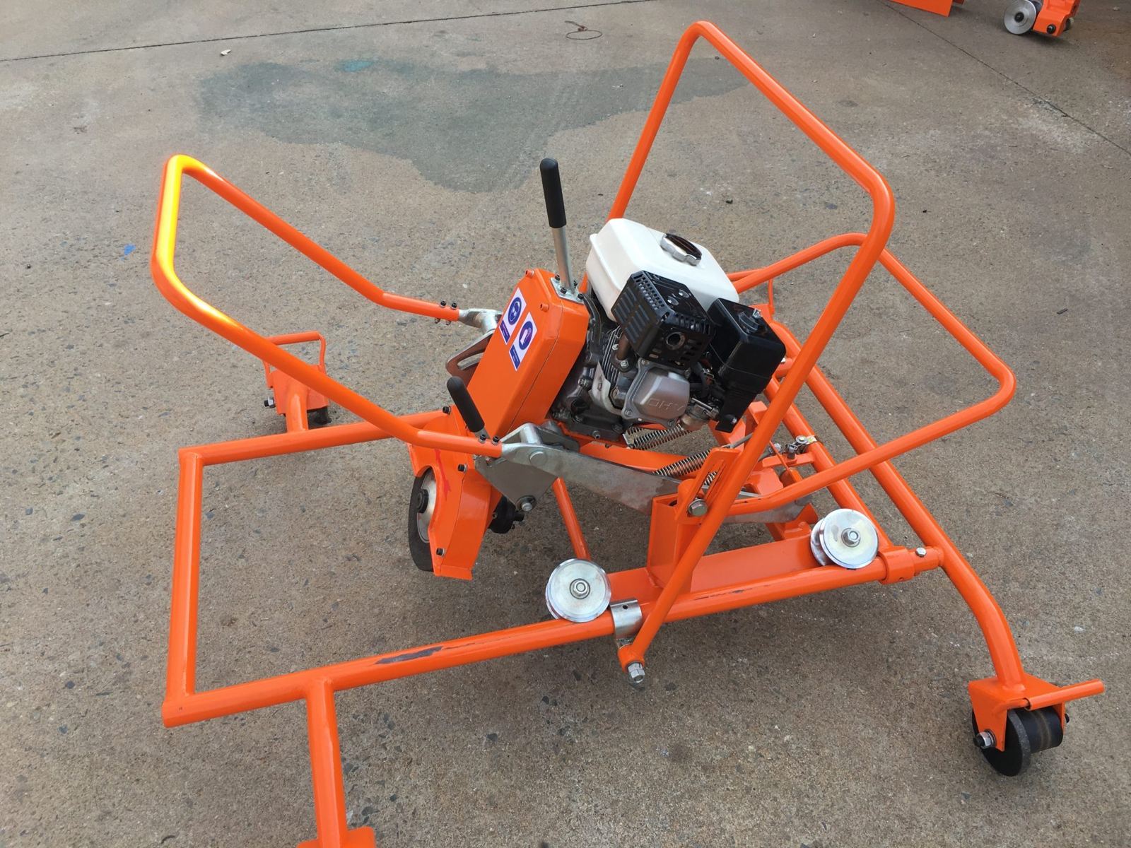 Petrol-powered rough rail grinder on its track frame